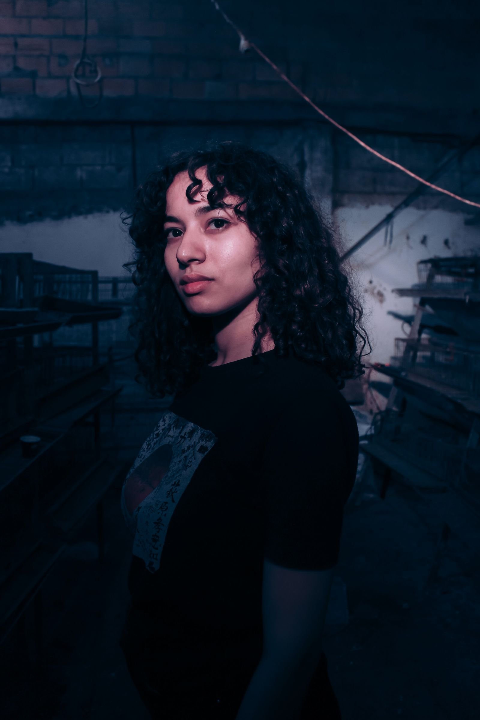 An atmospheric, moody portrait in low light evoking a grunge-era band
