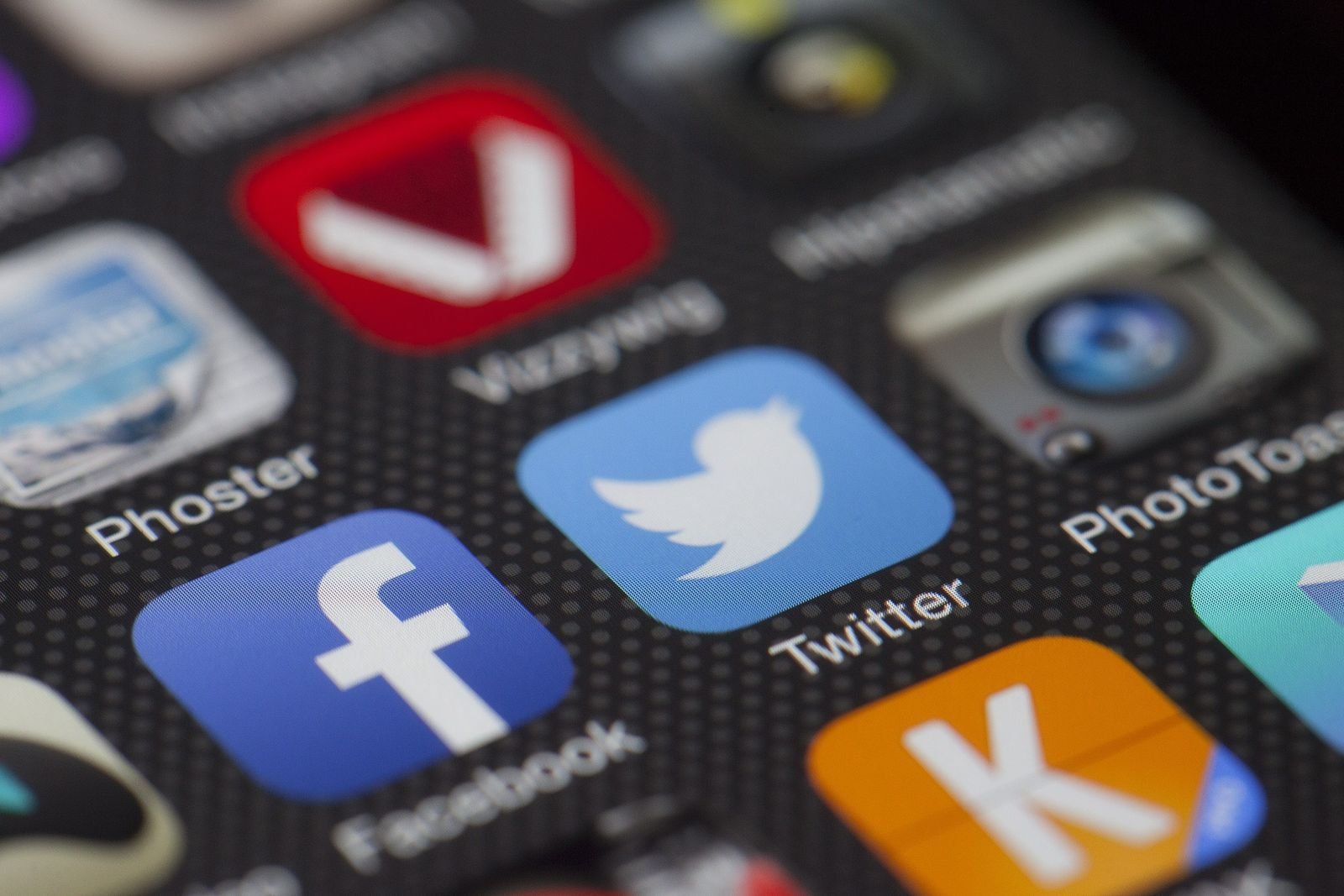 Close-up of social media app icons on a smartphone screen